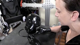 Gimp in spandex is dominated and punished by a cruel lady