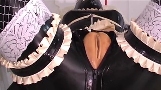 One damsel is roped in spandex as the other one belt dick screws her